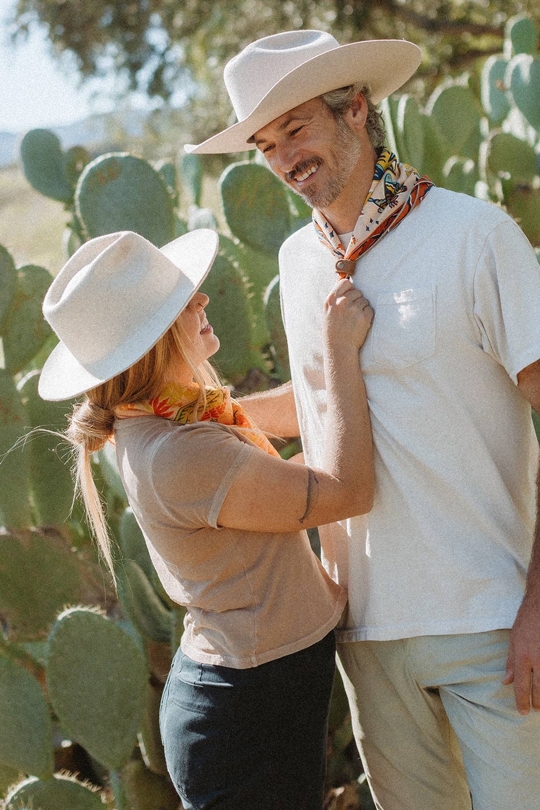 The Desert Sun Bandana by Bandits Bandanas features original artwork by Michael Matheson (Metal Teepee) and is made from Fair Trade Certified, 100% organic cotton. Soft, breathable, and versatile, this 21" × 21" bandana is perfect for hair, neck, or bag styling. Each purchase gives back, with 10% of proceeds supporting the International Rescue Committee, making it a meaningful, artist-driven accessory designed to be lived in.