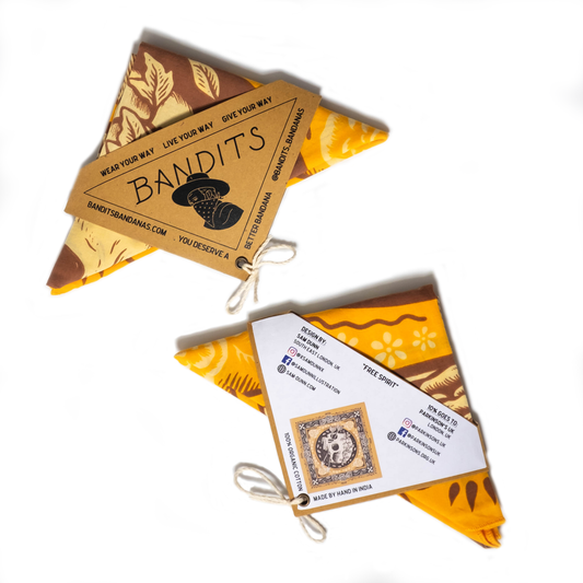 The Free Spirit Bandana by Bandits Bandanas features original artwork by Sam Dunn and is crafted from GOTS-certified, sustainably sourced organic cotton. Fair Trade Certified and ultra-soft, this 21" × 21" bandana is designed for everyday wear—styled at the neck, in the hair, or tied to a favorite bag. Each purchase gives back, with 10% of proceeds supporting Parkinson’s UK, making it a meaningful, artist-driven accessory designed to be lived in.