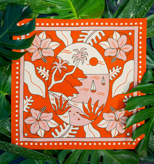 The Na’Pali Coast Bandana by Bandits Bandanas features original artwork by Lisa McCormick, inspired by the iconic coastline of Kaua‘i. Made from 100% GOTS-certified organic cotton and Fair Trade Certified, this ultra-soft bandana is a versatile accessory for hair, neck, bag styling, and everyday wear. Plus, 10% of proceeds support Love One International, making it a thoughtful, artist-driven gift with real impact.