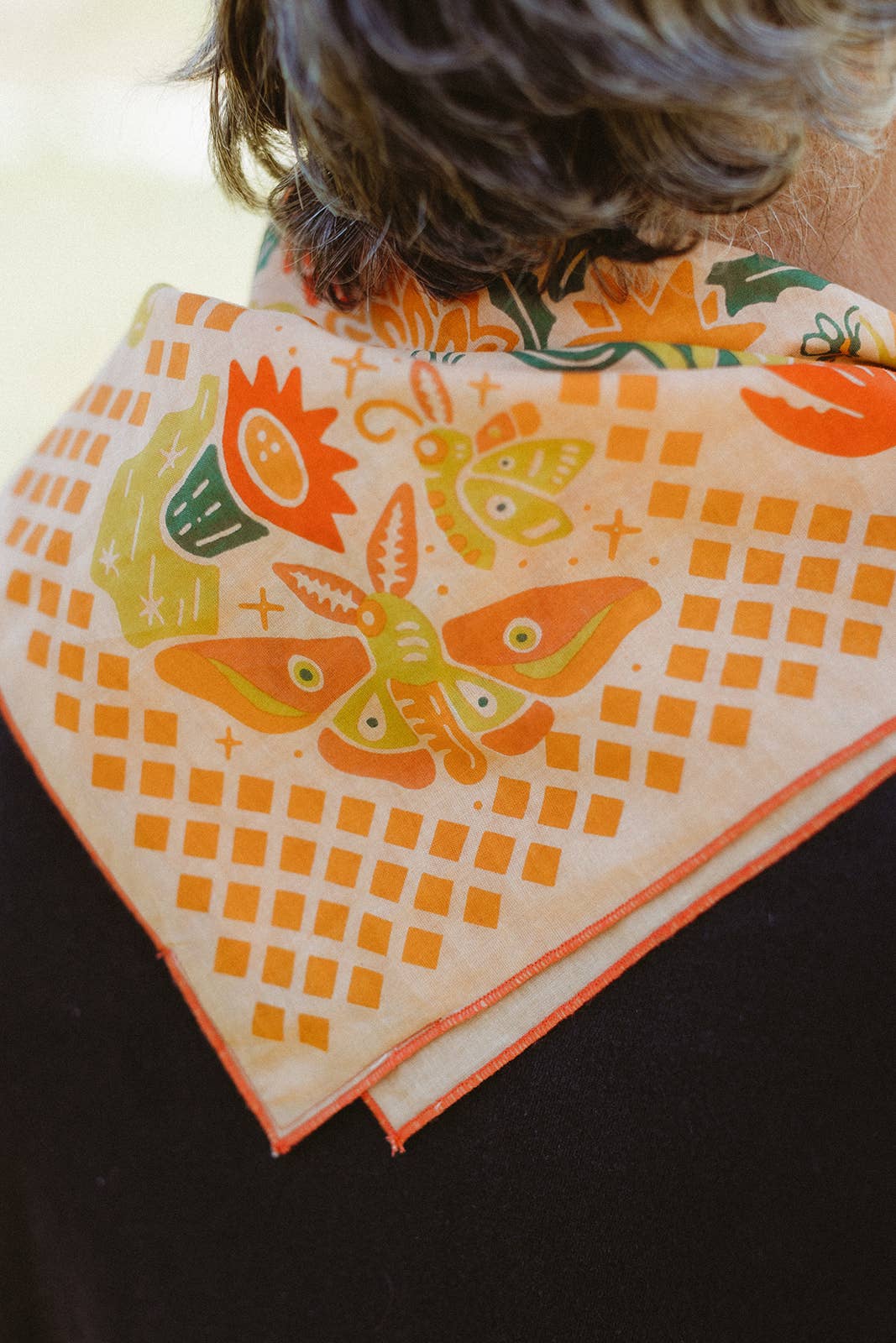 The Prickly Pollinators Bandana by Bandits Bandanas features original artwork by Zaine Vaun and celebrates the desert as a vibrant, living ecosystem. Made from GOTS-certified organic cotton and handcrafted in a Fair Trade Certified facility, this ultra-soft 21" × 21" bandana is perfect for styling in your hair, around your neck, or tied to a favorite bag. Each purchase gives back, with 10% of proceeds supporting Big Bend Conservation Alliance.