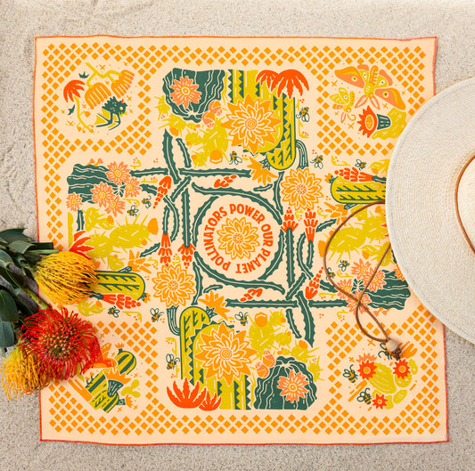 The Prickly Pollinators Bandana by Bandits Bandanas features original artwork by Zaine Vaun and celebrates the desert as a vibrant, living ecosystem. Made from GOTS-certified organic cotton and handcrafted in a Fair Trade Certified facility, this ultra-soft 21" × 21" bandana is perfect for styling in your hair, around your neck, or tied to a favorite bag. Each purchase gives back, with 10% of proceeds supporting Big Bend Conservation Alliance.
