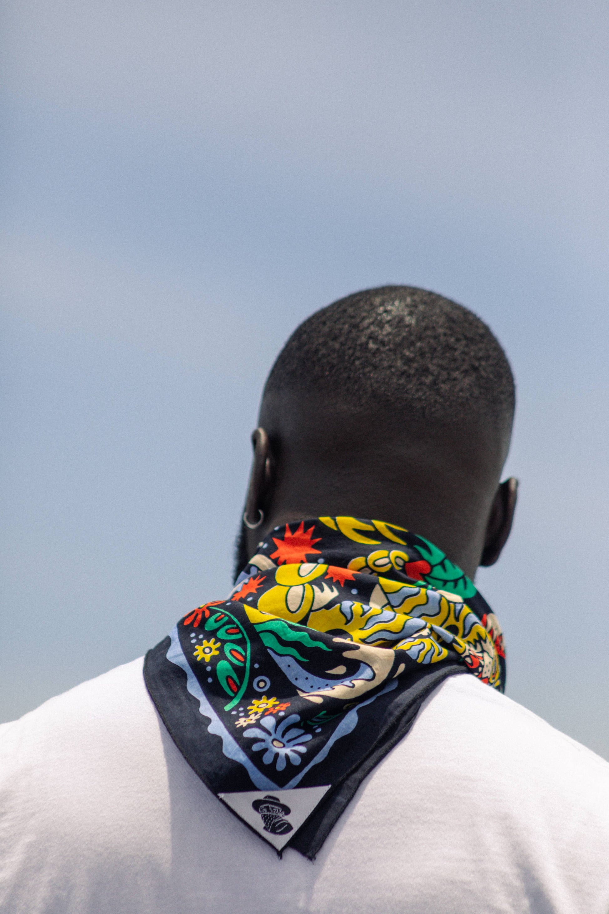 The Tropic Like It’s Hot Bandana by Bandits Bandanas features original artwork by Joshua Noom and is crafted from GOTS-certified, Fair Trade Certified organic cotton. Soft, breathable, and easy to style, this 21" × 21" bandana is perfect for everyday wear—at the neck, in the hair, or tied to a favorite bag. Each purchase gives back, with 10% of proceeds supporting American Red Cross Hurricane Relief, making it a vibrant, artist-driven accessory with meaningful impact.