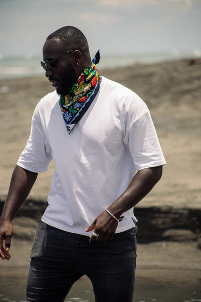 The Tropic Like It’s Hot Bandana by Bandits Bandanas features original artwork by Joshua Noom and is crafted from GOTS-certified, Fair Trade Certified organic cotton. Soft, breathable, and easy to style, this 21" × 21" bandana is perfect for everyday wear—at the neck, in the hair, or tied to a favorite bag. Each purchase gives back, with 10% of proceeds supporting American Red Cross Hurricane Relief, making it a vibrant, artist-driven accessory with meaningful impact.