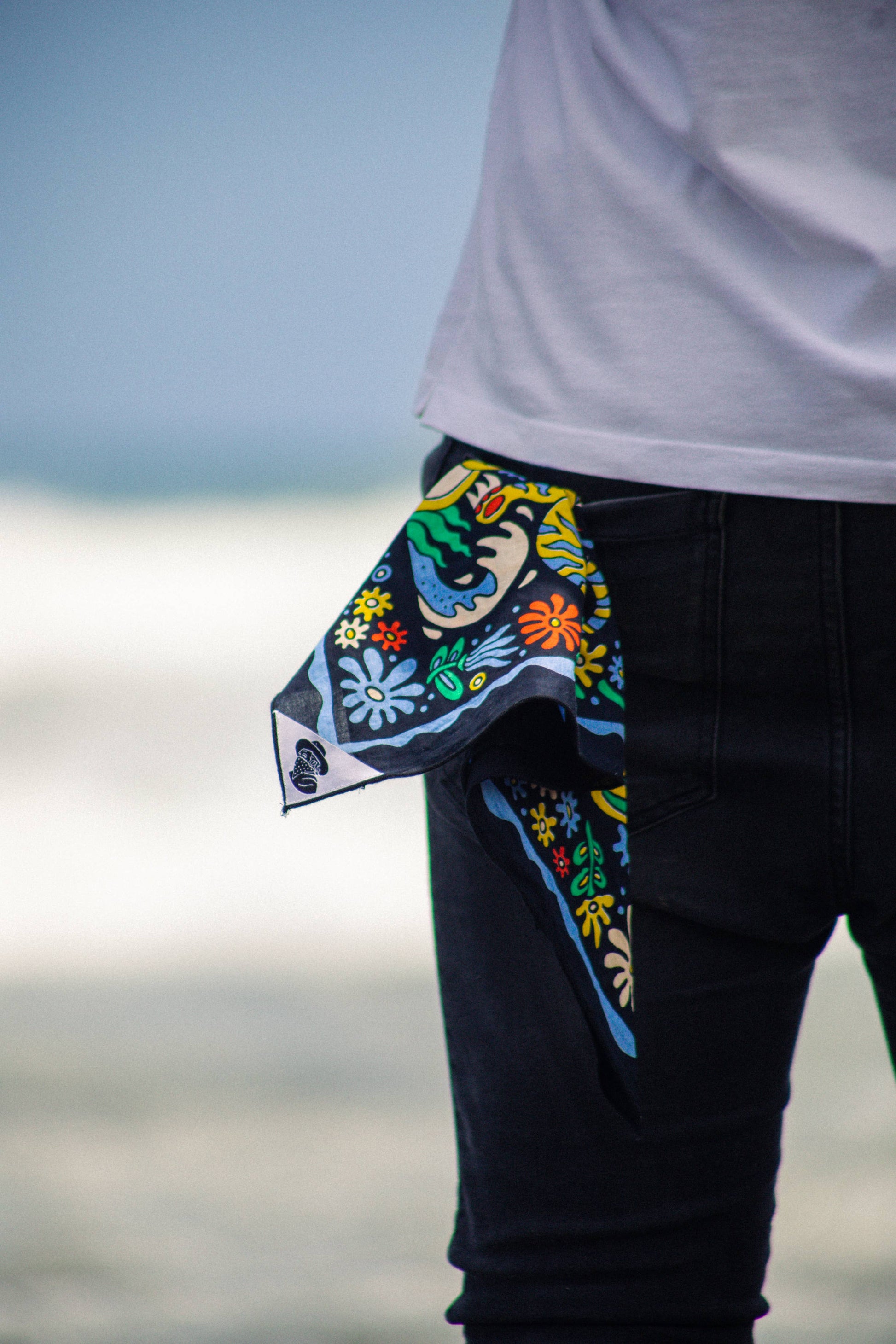 The Tropic Like It’s Hot Bandana by Bandits Bandanas features original artwork by Joshua Noom and is crafted from GOTS-certified, Fair Trade Certified organic cotton. Soft, breathable, and easy to style, this 21" × 21" bandana is perfect for everyday wear—at the neck, in the hair, or tied to a favorite bag. Each purchase gives back, with 10% of proceeds supporting American Red Cross Hurricane Relief, making it a vibrant, artist-driven accessory with meaningful impact.