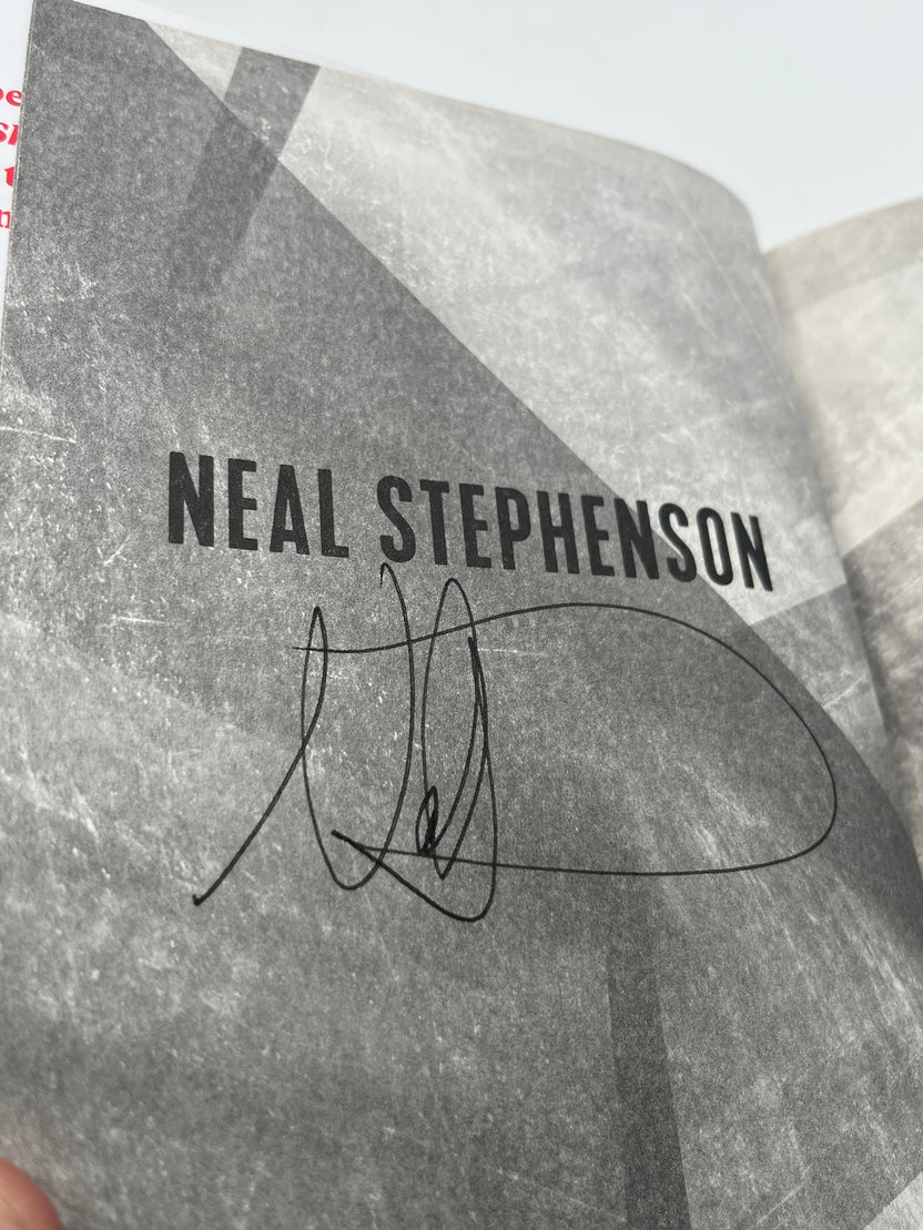 Preowned Very Good hardcover edition of Polostan by Neal Stephenson, published by Morrow, signed by the author. This signed copy shows a minor lower spine bump but is otherwise clean and well cared for. A compelling addition for fans of historical fiction, speculative storytelling, and collectors of signed science fiction and literary novels.