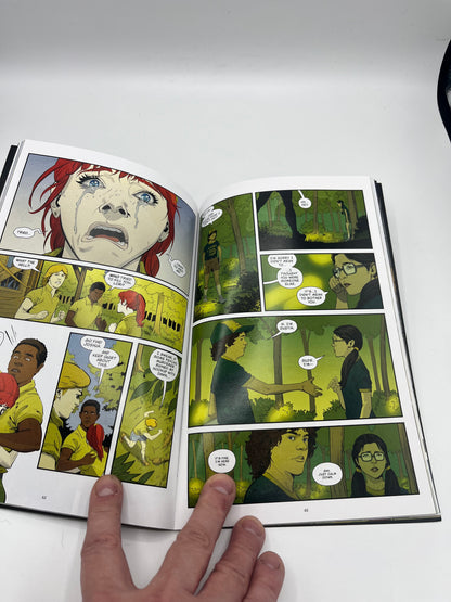 Preowned Very Good copy of Stranger Things: Science Camp, a Stranger Things graphic novel by Jody Houser and team. A fun horror-tinged mystery set in the Stranger Things world, perfect for fans of the series and readers who enjoy spooky adventures, sci-fi weirdness, and collectible tie-in comics.