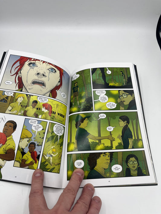 Preowned Very Good copy of Stranger Things: Science Camp, a Stranger Things graphic novel by Jody Houser and team. A fun horror-tinged mystery set in the Stranger Things world, perfect for fans of the series and readers who enjoy spooky adventures, sci-fi weirdness, and collectible tie-in comics.