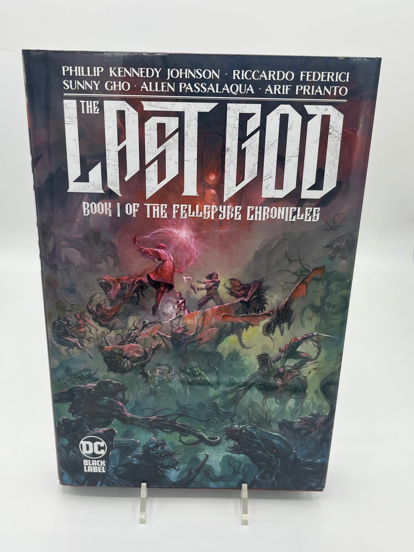 Preowned Very Good hardcover edition of The Last God: Book I of the Fellspyre Chronicles (DC Black Label), a dark fantasy graphic novel by Phillip Kennedy Johnson with stunning art by Riccardo Federici. This collectible hardcover with dust jacket includes the complete Book I story (issues #1–12) and is perfect for fans of epic fantasy, horror-tinged worldbuilding, and premium graphic novel editions.