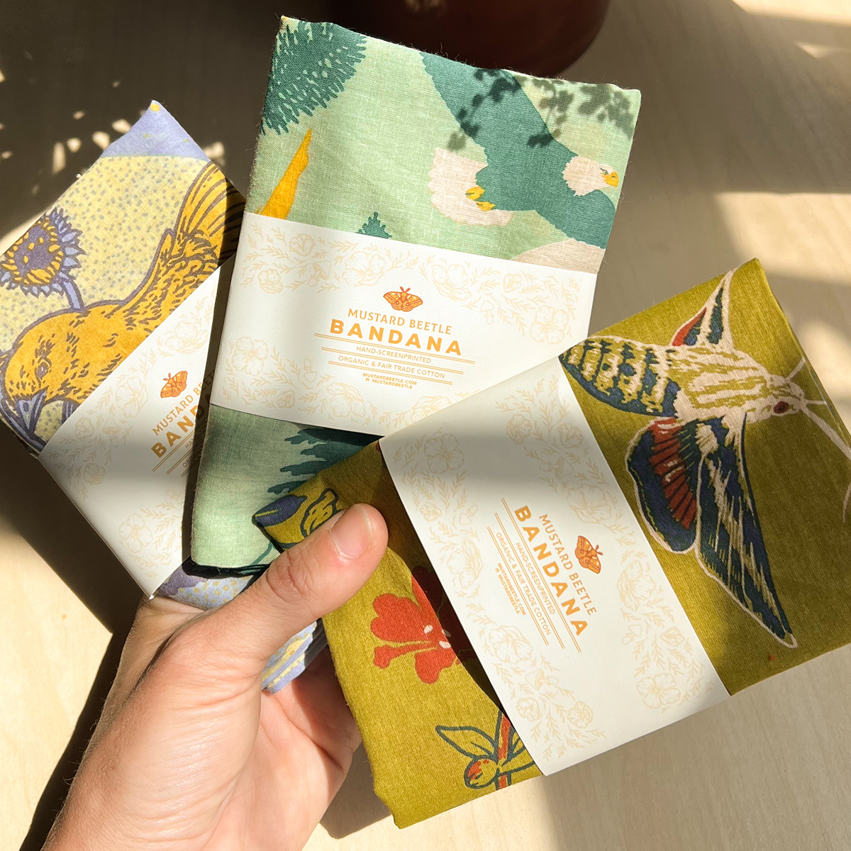 Mustard Beetle San Gabriel Foothills bandana, Southern California native species bandana, organic cotton Fair Trade bandana, eco friendly hand printed textile, botanical and wildlife illustration bandana, California Fuchsia bandana, Datura wrightii illustration, native moth and snake artwork textile, Elizabeth Jean Younce design, Mustard Beetle accessories, nature inspired cotton bandana, 22 inch cotton bandana, eco conscious wearable art, collectible artist textile, Rogue & Rye nature goods, sustainable fa