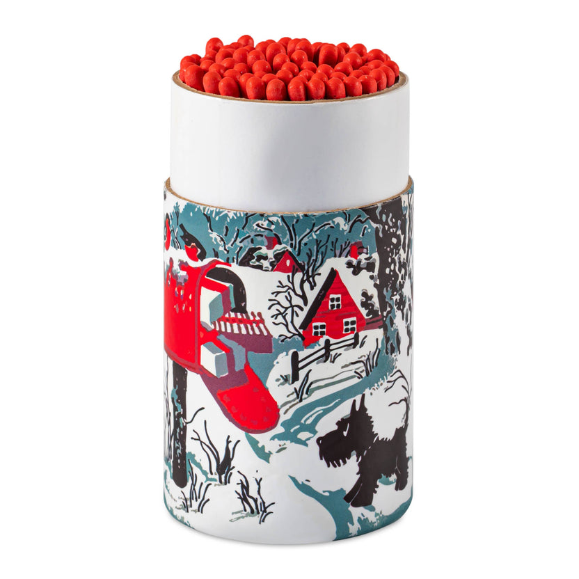 Snowy Letterbox match cylinder, Westie Christmas matchbox, winter dog illustration, large holiday match tube, festive safety matches, Christmas table décor, UK-made match cylinder, winter landscape artwork, decorative match container, holiday gift for dog lovers, collectible Christmas matchbox, Archivist holiday collection, Rogue & Rye curated seasonal gifts, charming winter match design.
