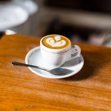 Beautiful espresso drink with heart-shaped latte art crafted from Sightglass Coffee espresso