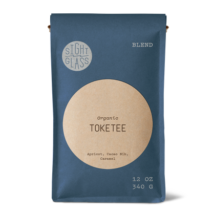 Front of Sightglass Coffee Toketee organic blend 12 oz bag with tasting notes of apricot, cacao nib, and caramel.