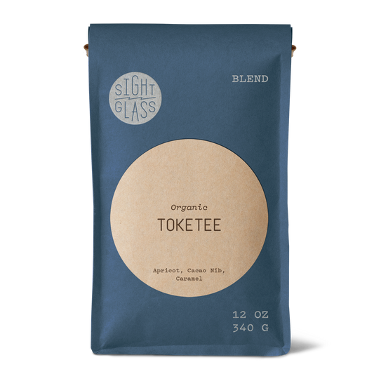 Front of Sightglass Coffee Toketee organic blend 12 oz bag with tasting notes of apricot, cacao nib, and caramel.