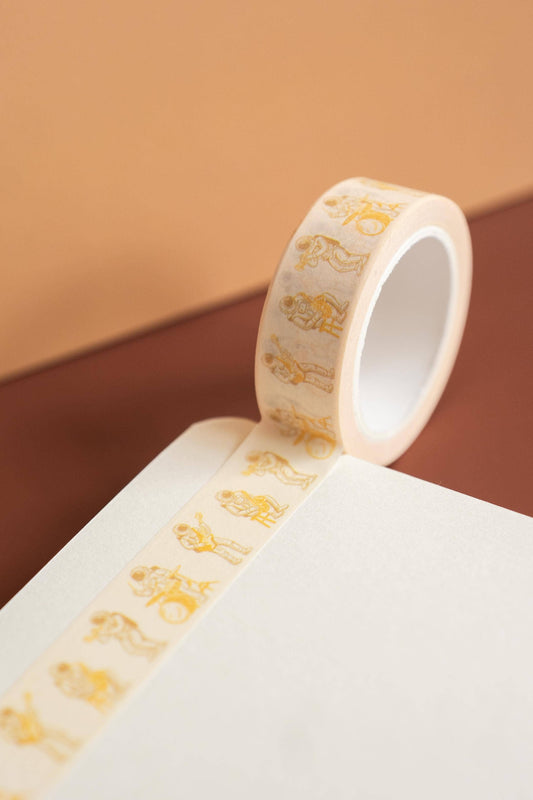 Space Jams washi tape unrolled to show the repeating astronaut band illustration