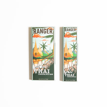 thai chocolate bar, adventure series chocolate, coconut milk chocolate, galangal chocolate bar, white pepper chocolate, crunchy rice chocolate, thai inspired sweets, artisan chocolate Portland Oregon, small batch chocolate, Ranger Chocolate Co., organic cacao chocolate bar, unique flavor chocolate, gourmet chocolate gifts, bean to bar adventure chocolate, Rogue and Rye artisan foods, global flavors chocolate, chocolate for foodies, craft chocolate with coconut milk, fair trade cacao chocolate, specialty cho