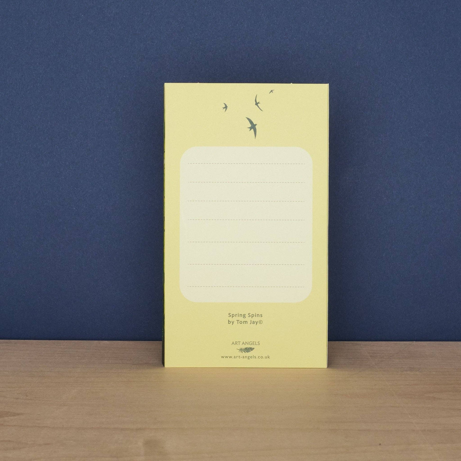 Back of the Tom Jay Spring Spins die-cut greeting card with a lined message area for writing.