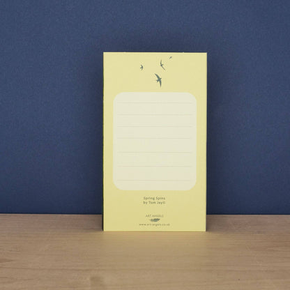 Back of the Tom Jay Spring Spins die-cut greeting card with a lined message area for writing.