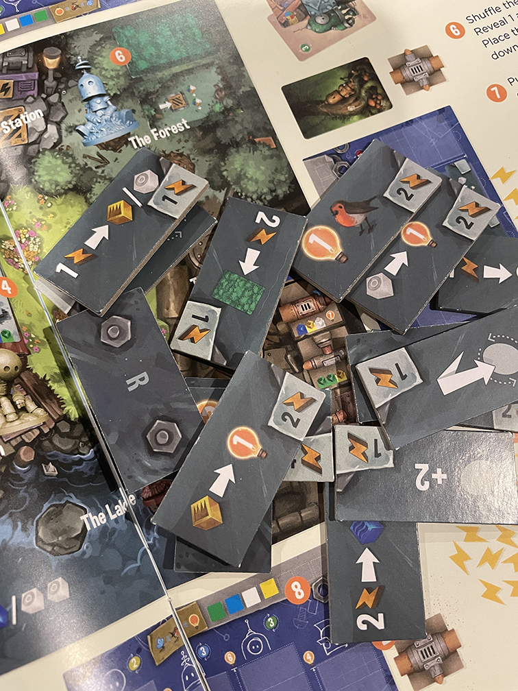 Transmissions board game, Transmissions game, Matt Dixon Transmissions, robot board game, illustrated board game, worker placement game, rondel board game, shared worker board game, engine building board game, strategy board game 1 to 4 players, solo strategy board game, 60 minute strategy game, family strategy game age 10+, miniature robots board game, board game with pipes, build a pipe network board game, engrams and electricity game, adorable robots tabletop game, welcoming strategy board game, modern e