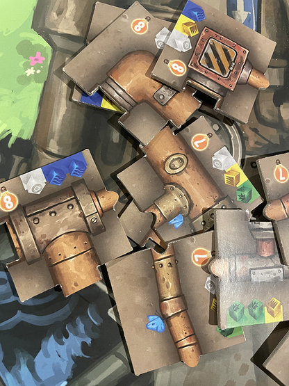 Transmissions board game, Transmissions game, Matt Dixon Transmissions, robot board game, illustrated board game, worker placement game, rondel board game, shared worker board game, engine building board game, strategy board game 1 to 4 players, solo strategy board game, 60 minute strategy game, family strategy game age 10+, miniature robots board game, board game with pipes, build a pipe network board game, engrams and electricity game, adorable robots tabletop game, welcoming strategy board game, modern e