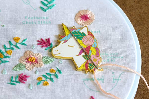 unicorn needleminder, magnetic needle holder, enamel needle minder unicorn, embroidery hoop accessories, cross-stitch unicorn magnet, rare earth magnet needle tool, cute unicorn sewing notion, whimsical embroidery gift, magical stitch marker