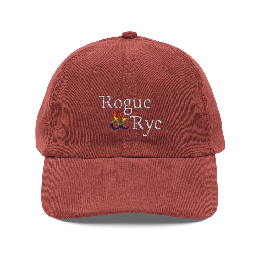 and pride hat, lgbtq corduroy cap, pride embroidered hat, queer and questioning cap, rogue and rye pride, inclusive pride apparel, outright international donation, and hat message, unstructured low profile cap, soft corduroy hat, queer pride gear, gender inclusive pride, thoughtful pride gift, adjustable pride cap, rogue and rye hat, embroidered message hat, live outside the binary, pride fashion statement, soft cotton pride hat