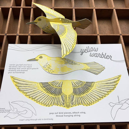 warbler pop-out card, yellow warbler greeting card, bird symbolism card, focus and growth gift, letterpress bird card, yellow and gray letterpress, 3d bird ornament card, cotton paper pop-out card, displayable bird paper craft, woodland bird stationery, birthday bird card, artisan letterpress card, hanging bird ornament, blackbird letterpress pop-out collection, rogue & rye nature cards