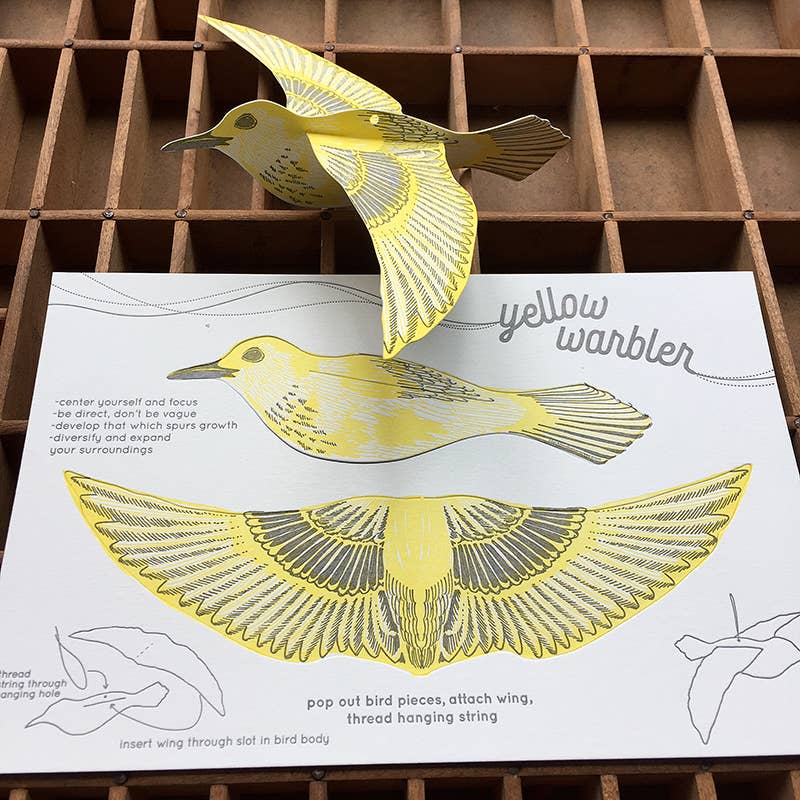 warbler pop-out card, yellow warbler greeting card, bird symbolism card, focus and growth gift, letterpress bird card, yellow and gray letterpress, 3d bird ornament card, cotton paper pop-out card, displayable bird paper craft, woodland bird stationery, birthday bird card, artisan letterpress card, hanging bird ornament, blackbird letterpress pop-out collection, rogue & rye nature cards